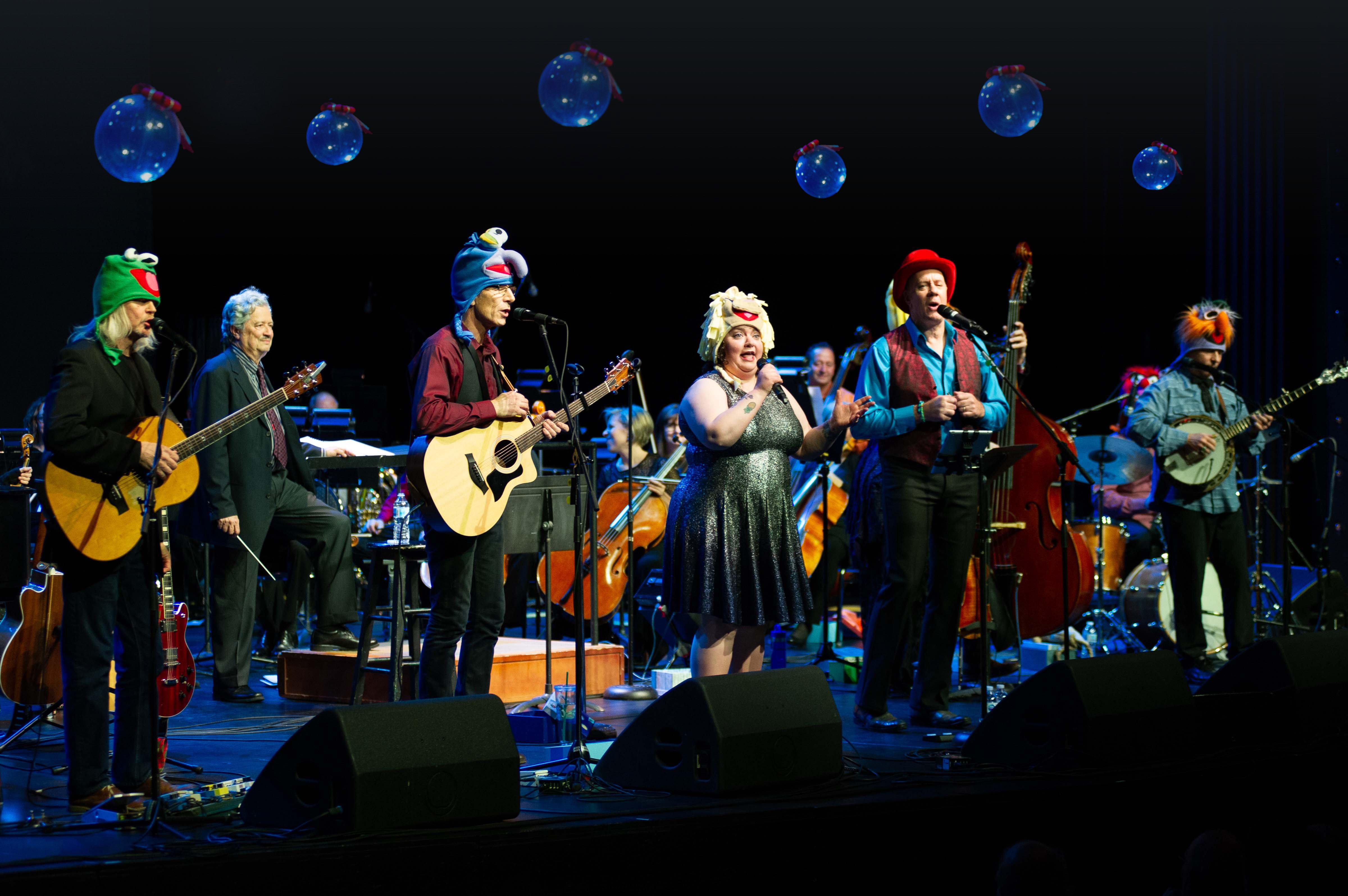 Artist in Rocky Mountain High Christmas playing instruments on stage 